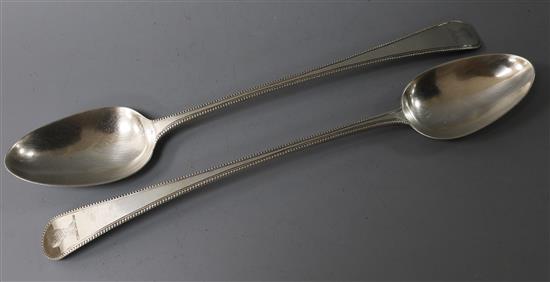 A pair of George III silver beaded Old English pattern basting spoons, Pratt & Humphries, London, 1783, 7 oz.